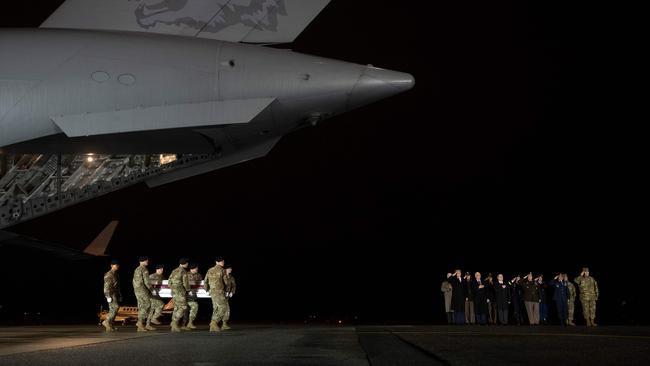 Donald Trump and Mike Pence at the return to US soil of two US soldiers killed in Afghanistan in February. Picture: AFP