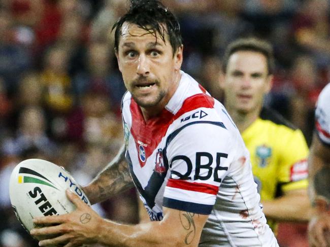 Mitchell Pearce of the Roosters passes the ball during the Round 6 NRL match between the Brisbane Broncos and the Sydney Roosters at Suncorp Stadium in Brisbane, Thursday, April 6, 2017. (AAP Image/Glenn Hunt) NO ARCHIVING, EDITORIAL USE ONLY