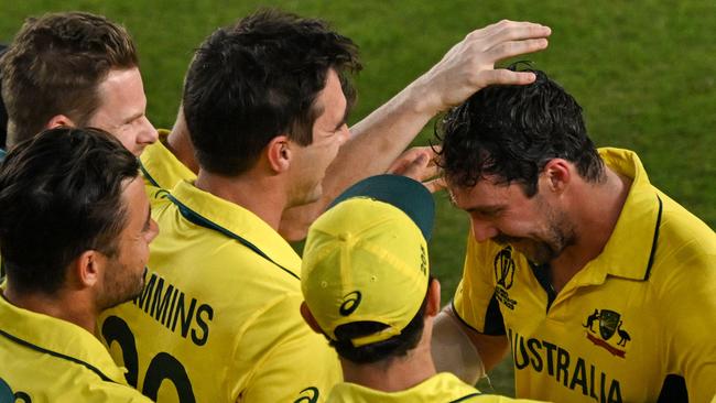 Australia's players celebrate after winning the 2023 ICC Men's Cricket World Cup one-day international (ODI) final match between India and Australia at the Narendra Modi Stadium in Ahmedabad on November 19, 2023. (Photo by Money SHARMA / AFP) / -- IMAGE RESTRICTED TO EDITORIAL USE - STRICTLY NO COMMERCIAL USE --