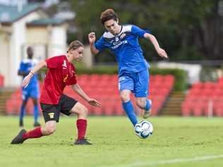 UNDER PRESSURE: South West Queensland Thunder midfielder Shota Aizawa skips around Sunshine Coast player Harrisson Bowen's tackle in their NPL QLD match at the weekend. Picture: Kevin Farmer