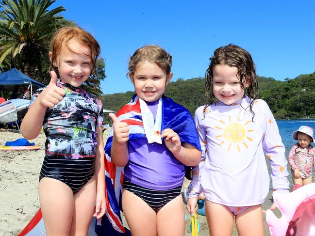 Celebrating Australia Day at Tallebudgera Creek were 5-year-olds Talaila Riek and Imogen Ferguson, along with 6-year-old Chloe Ferguson Photo: Scott Powick