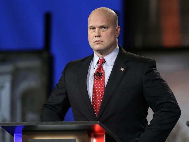 FILE - In this April 24, 2014, file photo, then-Iowa Republican senatorial candidate and former U.S. Attorney Matt Whitaker watches before a live televised debate in Johnston, Iowa. President Donald Trump announced in a tweet that he was naming Whitaker, as acting attorney general, after Attorney General Jeff Sessions was pushed out Nov. 7, 2018, as the country's chief law enforcement officer after enduring more than a year of blistering and personal attacks from Trump over his recusal from the Russia investigation. (AP Photo/Charlie Neibergall, File)
