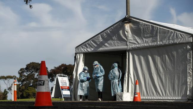 Health workers congregate at a testing tent at the Clyde pop-up clinic. Picture: NCA NewsWire / Daniel Pockett