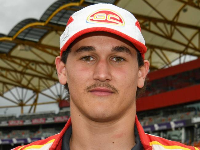 Gold Coast Suns player Wil Powell in the driving kit of a Supercars team. Picture credit: Deion Menzies/Highflyer Images