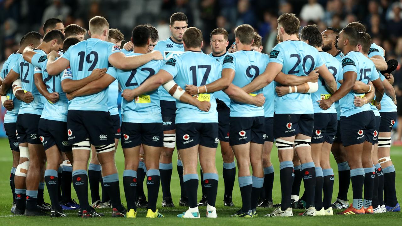 Waratahs players huddle before the round 11 Super Rugby match in Sydney.