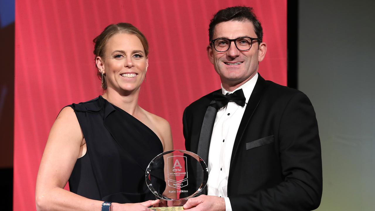 Kate Lutkins of the Brisbane Lions poses with her All-Australian trophy and Travis Auld during the 2021 AFLW W Awards at The Gabba on April 20, 2021 in Brisbane, Australia. (Photo by Jono Searle/Getty Images)