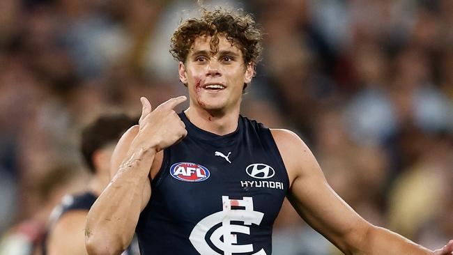 A cut to the face caused by boot studs didn’t stop Charlie Curnow from producing late heroics in defence to help Carlton beat Richmond on Thursday night. Picture: Michael Willson / Getty Images