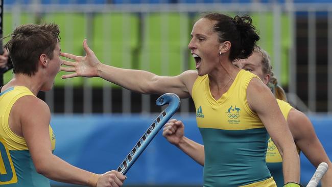 Australia's Madonna Blyth, right, celebrates with teammates after a goal.