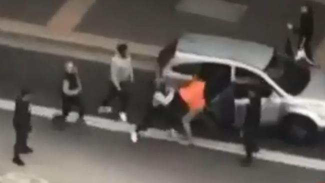 The wild brawl at the traffic lights outside Westfield. Picture: 7 News