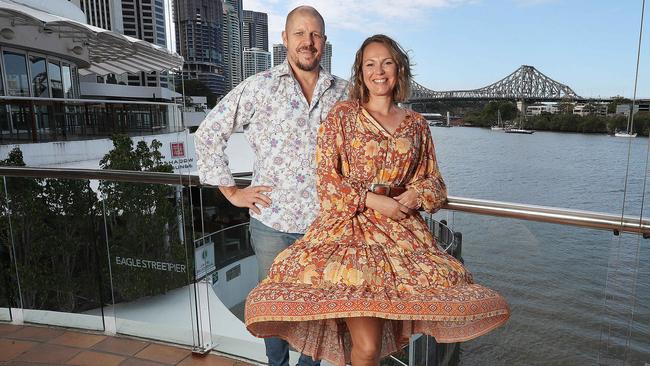 Owners Andrew Baturo and Jaimee Pickless on the balcony of their new restaurant at Eagle Street Pier in Brisbane’s CBD. Picture: Annette Dew