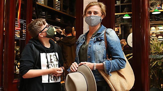 Karla Prince with her son Fraser in search of a good deal at the Strand Hatters in Sydney’s CBD. Picture: Jane Dempster