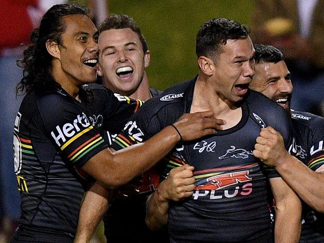 Brent Naden of the Panthers (centre) celebrates with teammates after scoring a try during the Round 18 NRL match between the Penrith Panthers and the St George Illawarra Dragons at Panthers Stadium in Sydney, Friday, July 19, 2019. (AAP Image/Dan Himbrechts) NO ARCHIVING, EDITORIAL USE ONLY