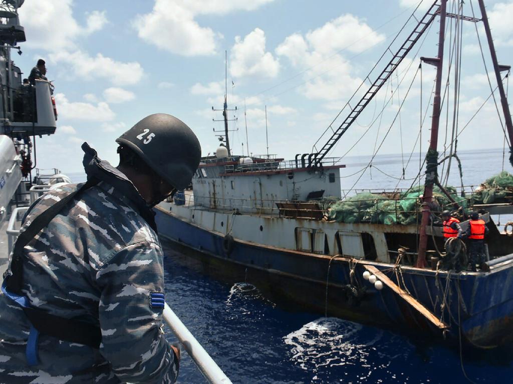 Indonesian warship KRI Imam Bonjol-363 arresting a Chinese fishing boat in Natuna Sea on a “ruse” for Beijing to stake a fishing claim to that sea in the southern most portion of South China Sea. Picture: Indonesian Navy /AFP