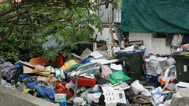 20 Years And 13 Clean-ups Later, Hoarder House Still Causes A Stink 