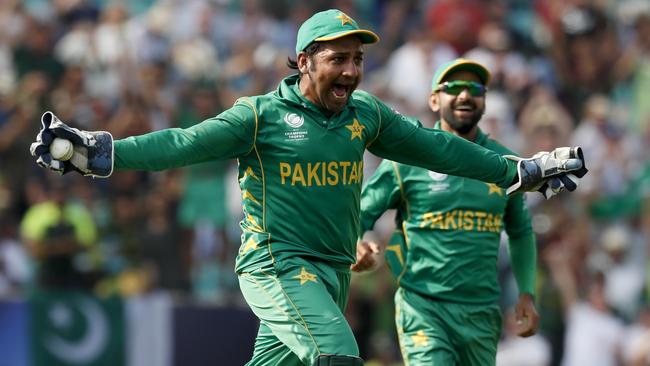 Pakistan's captain Sarfraz Ahmed celebrates taking the final catch to claim the Champions Trophy.