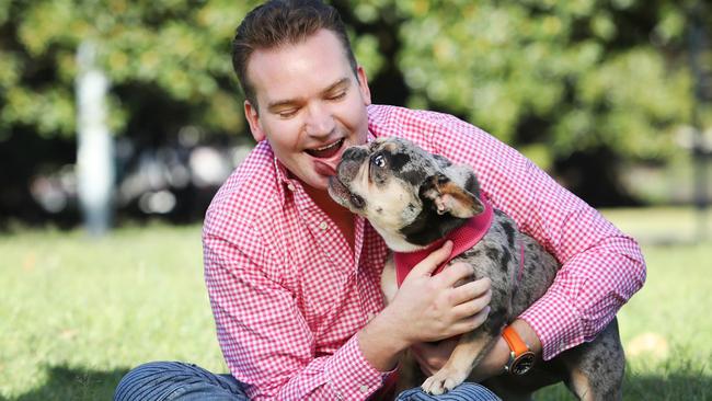 Sydney vet Dr Sam Kovac, pictured with bulldog Bowie, has established a new surgical technique to help the snuffly breed breathe easy. Picture: AC Agency.