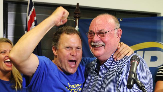 Former Barron River MP Michael Trout cheers on Warren Entsch during his victory speech to supporters at his post-election party. PICTURE: BRENDAN RADKE