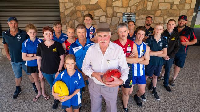 Members, coaches and players from the Upper Murray Football League outside the new Corryong community football netball club house. Photo: Simon Dallinger