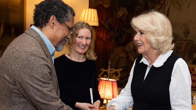 Britain's Queen Camilla (R) shakes hands with US writer Percival Everett during a reception for the Booker Prize Foundation at Clarence House, in London, on November 12, 2024 ahead of the Booker Prize 2024 ceremony. The winner of the Booker Prize is to be announced on November 12, 2024 with a record five female authors vying to win the prestigious English-language literary award. Six authors from five countries have been shortlisted, with the winner of the Â£50,000 ($64,500) prize to be announced at a glitzy ceremony in London. (Photo by Aaron Chown / POOL / AFP)