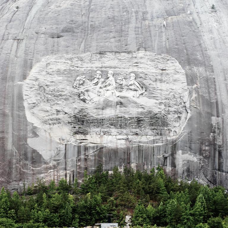 The park is popular for visitors given its 250-metre mountain features intricate carvings of confederate figures Jefferson Davis, Robert E. Lee and Thomas ‘Stonewall’ Jackson. Picture: Getty Images