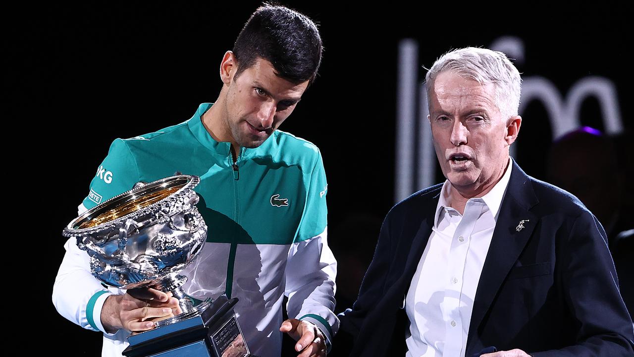 MELBOURNE, AUSTRALIA - FEBRUARY 21: Novak Djokovic of Serbia speaks with CEO of Tennis Australia Craig Tiley as he holds the Norman Brookes Challenge Cup following victory in his MenÃ¢â¬â¢s Singles Final match against Daniil Medvedev of Russia  during day 14 of the 2021 Australian Open at Melbourne Park on February 21, 2021 in Melbourne, Australia. (Photo by Cameron Spencer/Getty Images)