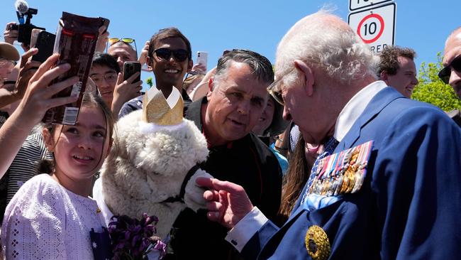 Britain’s King Charles III reacts as he is introduced to an alpaca named Hephner during a walkabout outside the Australian War Memorial in Canberra on October 21, 2024. Picture: Mark Baker / POOL / AFP
