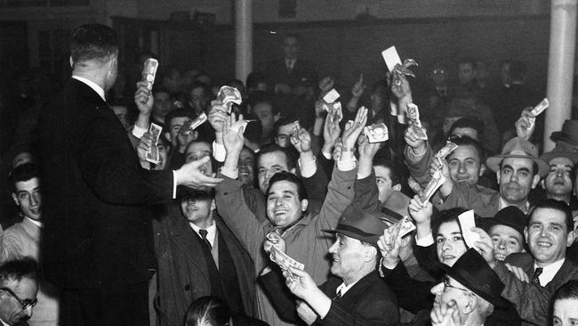 Members of the Greek community donate to a relief fund to victims of the Greek Ionian Islands earthquake disaster in 1953.