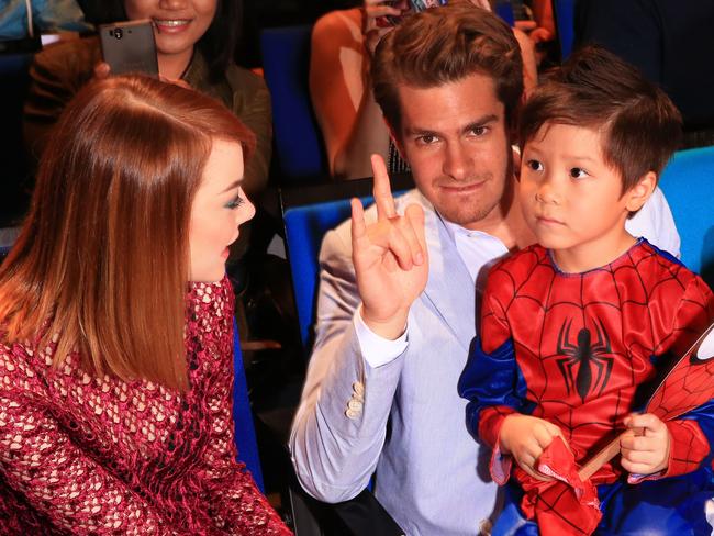 Recast ... Emma Stone and Andrew Garfield with a Spider-Man fan. The pair play Spider-Man and Gwen Stacy in the reboot but are unlikely to continue in the roles. Picture: Getty