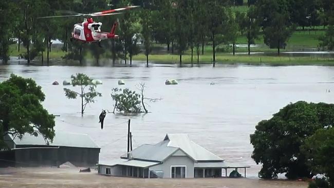 A helicopter evacuation near Taree on the NSW north coast on Sunday. Picture: Twitter / @NSWRFS