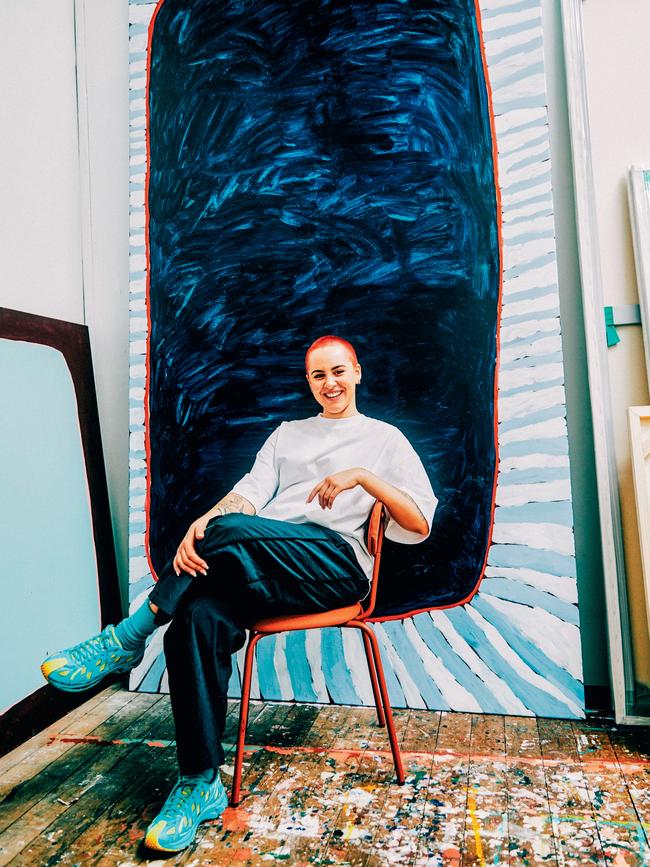 The artist in her Marrickville studio, in front of her work Those parts of the river, where the sun don't hit (2024). Picture: Robert Mcgrath