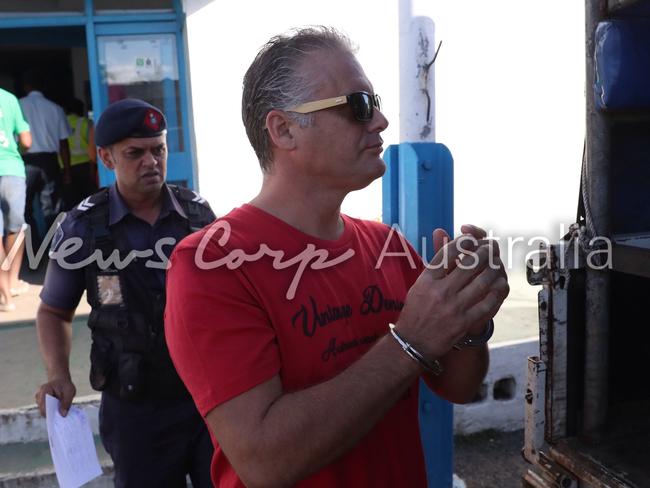 Nikolic was handcuffed as he was taken in to the Magistrates Court in Nadi. Picture: Gary Ramag