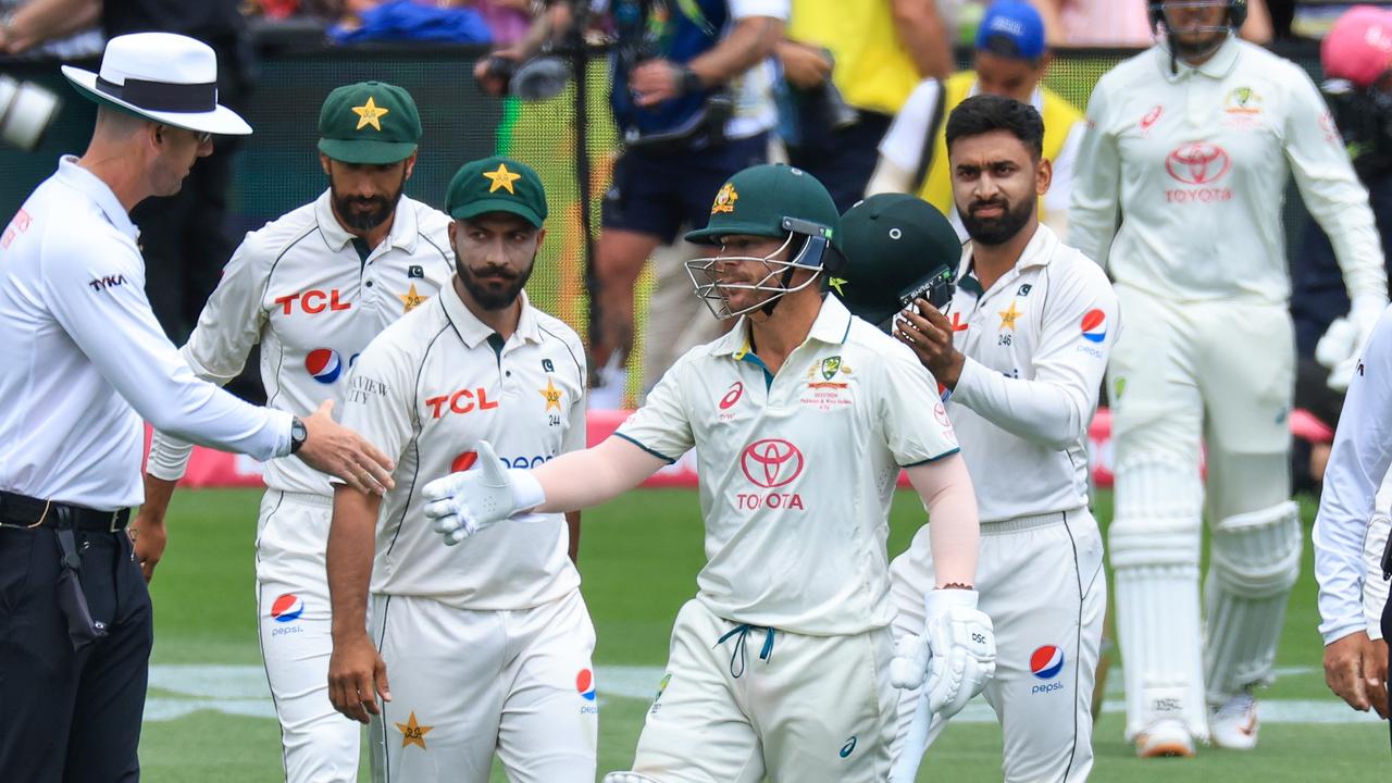 David Warner shakes hands with the umpire as he walks out to bat for his final Test match innings. (Photo by Mark Evans/Getty Images)