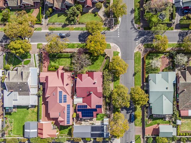 Aerial view of leafy eastern suburban houses on 4-way cross road intersection in Adelaide, South Australia, housing overhead real estate generic