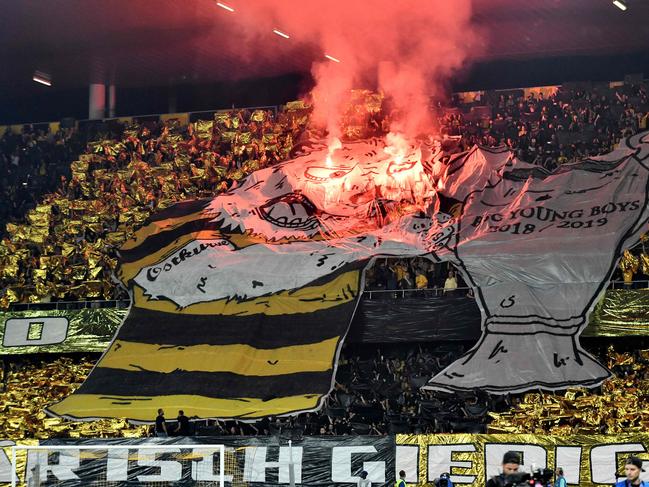 Supporters let off flares ahead of the UEFA Champions League group H football match between Young Boys and Manchester United. Picture: AFP