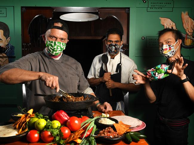 Hispanic Mechanic co-owner/Chef - Greggory Hill with  Line Chef - Mani Gill,  Restaurant Manager - Vinh Dang wearing the masks Chef Greggory commissioned his friend to make for him and his team to keep the customers safe from coronavirus and due to the shortage of masks available. He has also designed another range of food available for t/a that customers that is vaccumed sealed that they can put in their freezer and eat at another time to get through the coronavirus crisis.  Picture: Tricia Watkinson