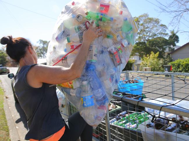 People across Sydney are reportedly making up to $2000 a week from grabbing recycled containers that attract the 10c refund. Picture: John Grainger