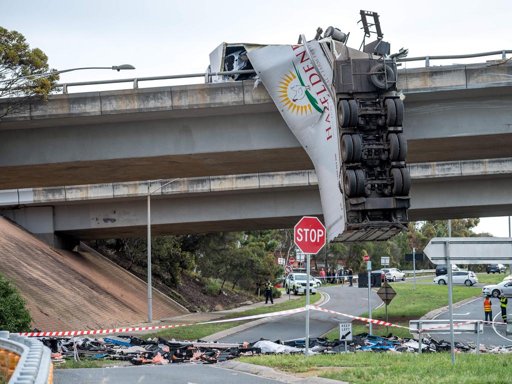 Melbourne traffic Truck crash Calder Freeway, hanging off bridge