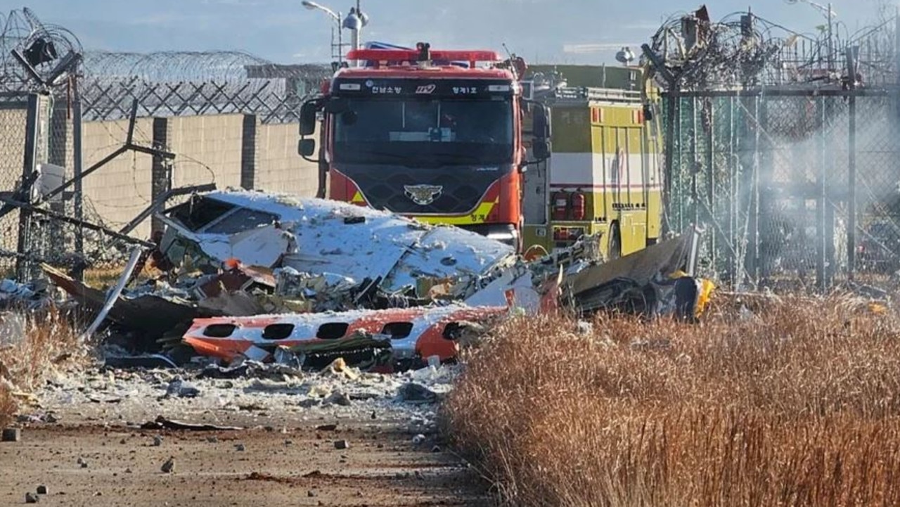 Fire engines work to extinguish a fire at the Muan International Airport. Picture: Maeng Dae-hwan / Newsis via AP