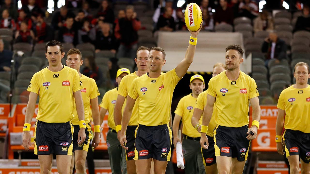 Umpire Brett Rosebury holds the ball aloft earlier this season.