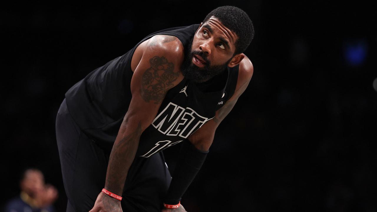 (FILES) In this file photo taken on October 31, 2022 Kyrie Irving #11 of the Brooklyn Nets looks on during a break in the action during the fourth quarter of the game against the Indiana Pacers at Barclays Center in New York City. - The Brooklyn Nets suspended Kyrie Irving for at least five games on Thursday, saying they were "dismayed" by the NBA star's response after he was criticized for posting a link to anti-semitic material. (Photo by Dustin Satloff / GETTY IMAGES NORTH AMERICA / AFP)