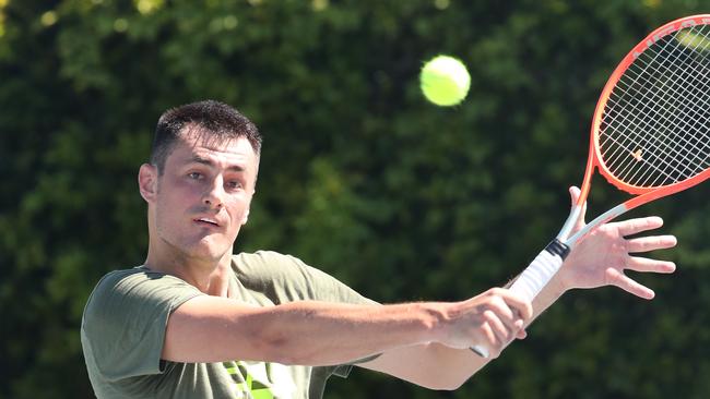 Bernard Tomic says he is committed to working hard to try to climb back up the ATP rankings. Picture: Glenn Hampson