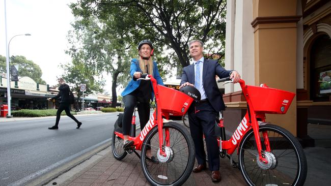 Naomi Doolette with Norwood, Payneham &amp; St Peters Mayor Robert Bria try out the new JUMP bikes. Photo: Kelly Barnes