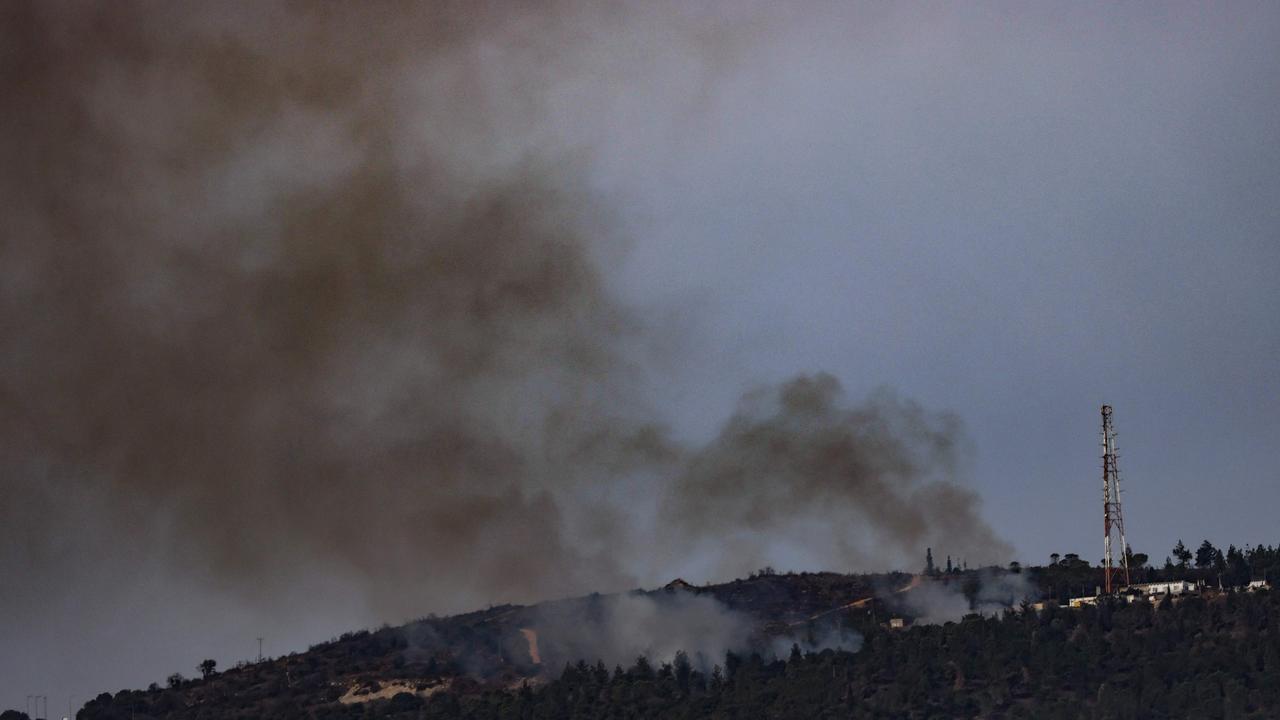 Smoke billows from hills in Ramim Ridge in the Upper Galilee after an exchange of fire between Israel and the Lebanese Hezbollah movement near Moshav Margaliot on Israel's border with Lebanon on November 11. Picture: AFP