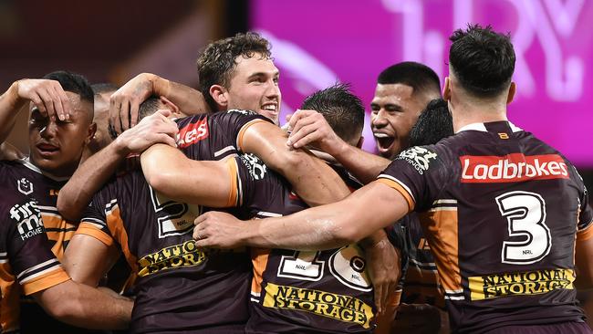 Xavier Coates celebrates with Corey Oates after scoring a try last season.