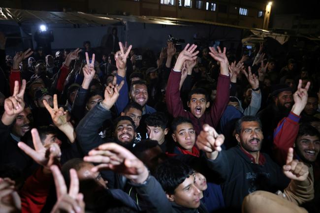 People in southern Gaza celebrate the announcement of a deal to end the 15-month war with Israel