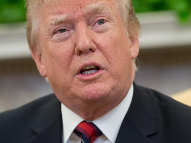 US President Donald Trump speaks during a meeting with South Korean President Moon Jae-in in the Oval Office of the White House in Washington, DC, May 22, 2018. Donald Trump welcomed South Korea's president to the White House Tuesday, a high stakes and potentially testy meeting that could decide whether the US leader's much-vaunted summit with Kim Jong Un goes ahead. / AFP PHOTO / SAUL LOEB