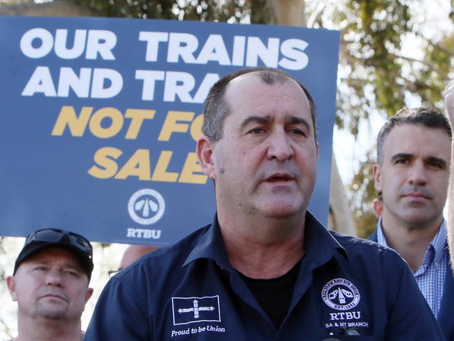 Rail, Train and Bus Union Protest at Cumberland Park Community Centre, Goodwood. Darren Phillips RTBU SA and NT Branch Secretary speaks to the media with Labor Leader Peter Malinauskas joined public transport workers as the Rail, Train and Bus Union launch its Our Trains and Trams: Not for Sale campaign to keep Adelaide Metro in public hands at Cumberland Park Community Centre, Goodwood. (AAP/Emma Brasier)