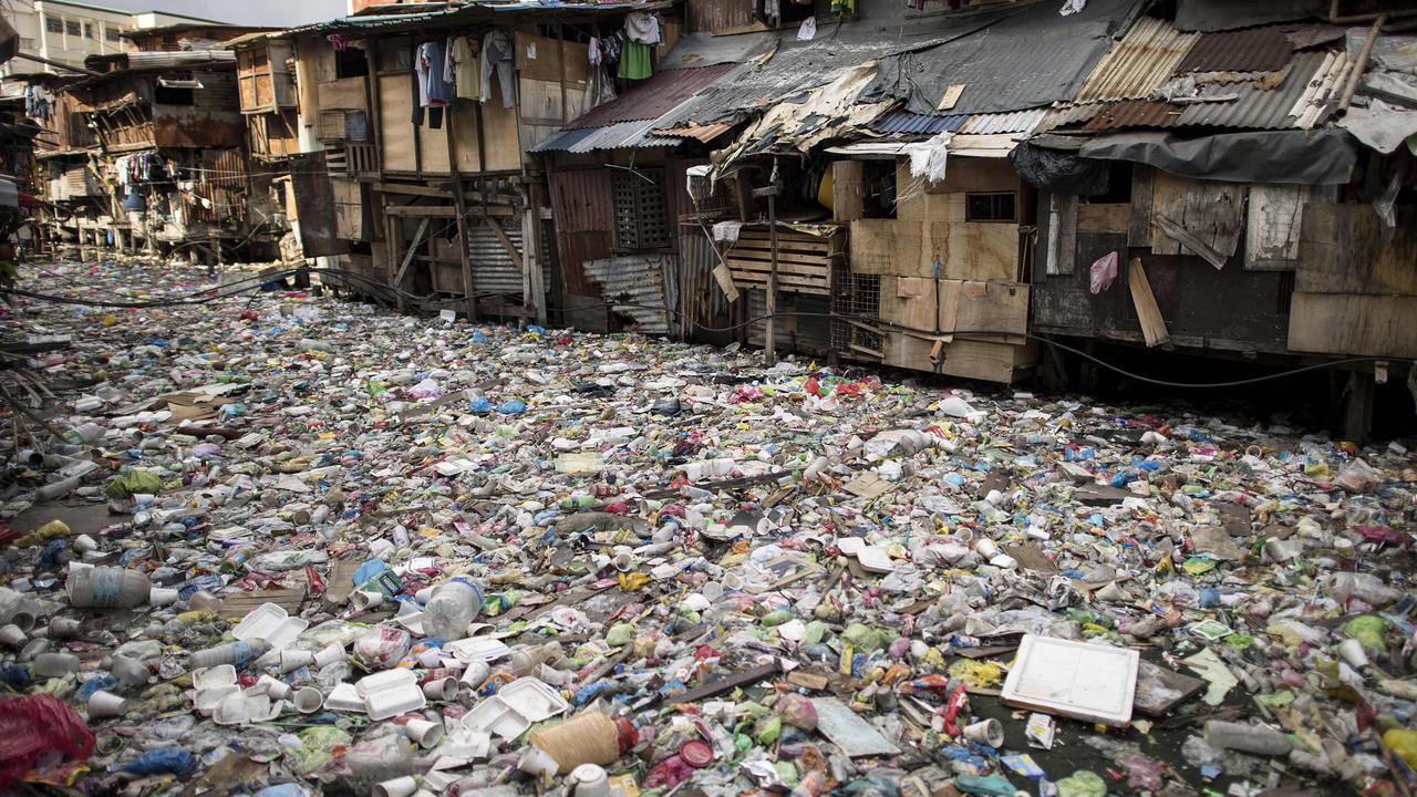 A garbage-filled creek in Manila. About eight million tonnes of plastic waste are dumped into the world's oceans every year - the equivalent of one garbage truck of plastic being tipped into the sea every minute. Picture: AFP