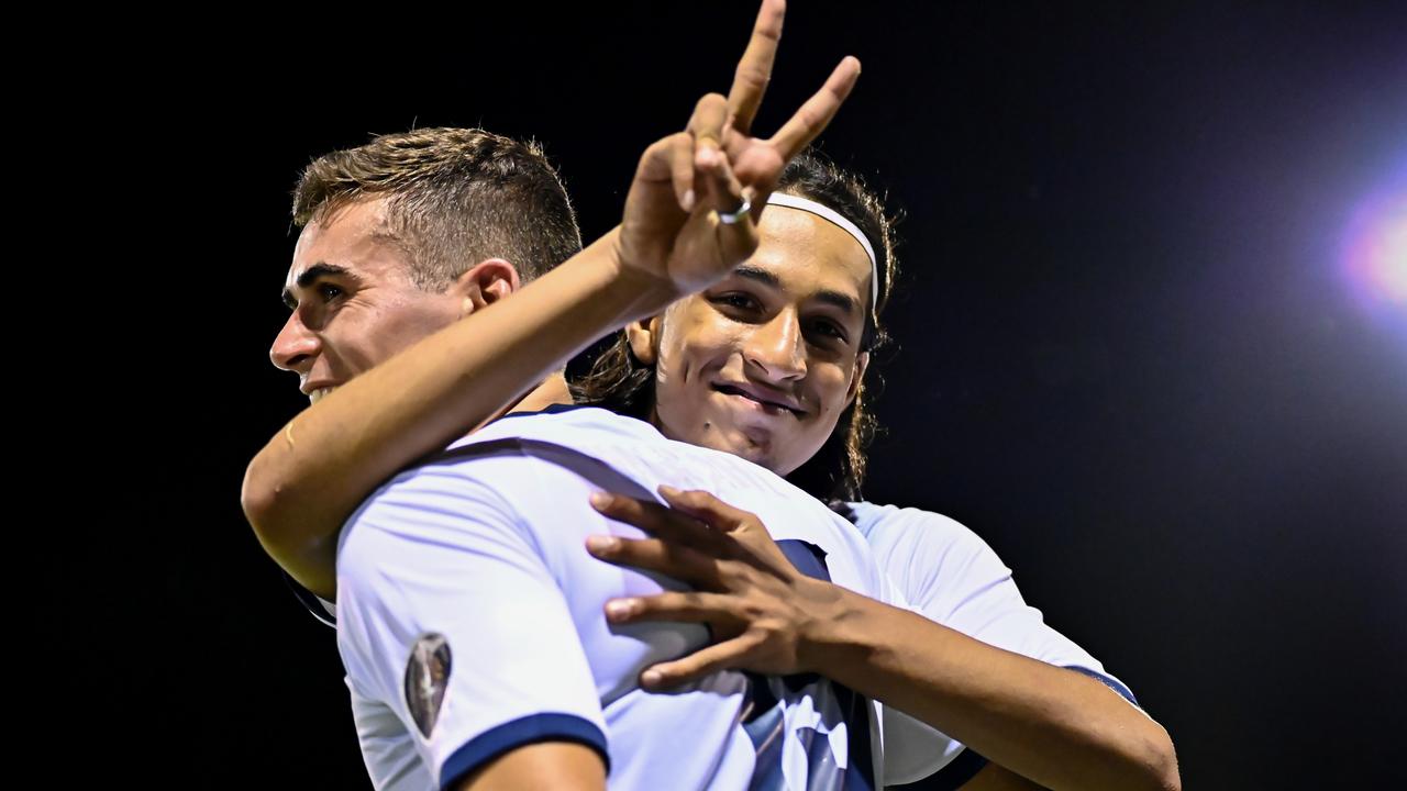 Gold Coast United full back Zahi Addis, 17, celebrates with teammate Tyler Wagstaffe. Photo: Kyoko