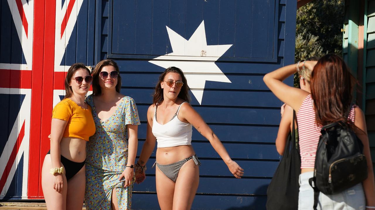 People are seen at Brighton Beach in Melbourne, Saturday, March 28. Picture: Scott Barbour